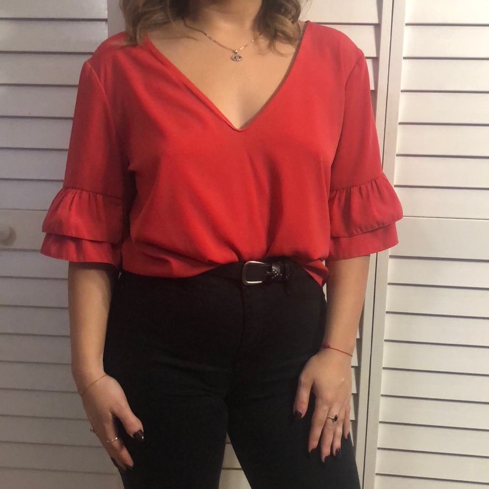 Orange/pink ruffle sleeve blouse
